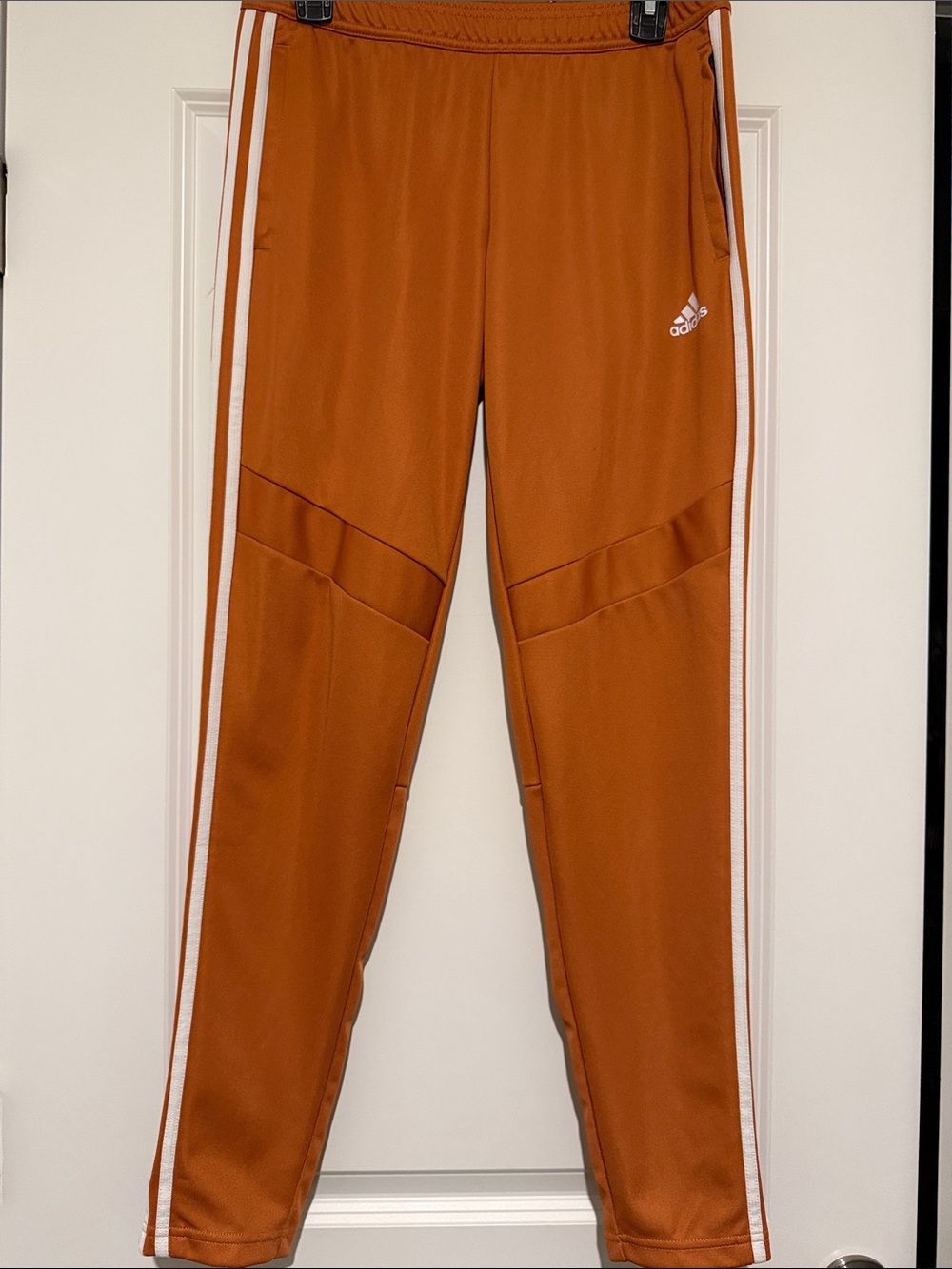 adidas women’s Rust-Orange Jogger Pants with White Stripes